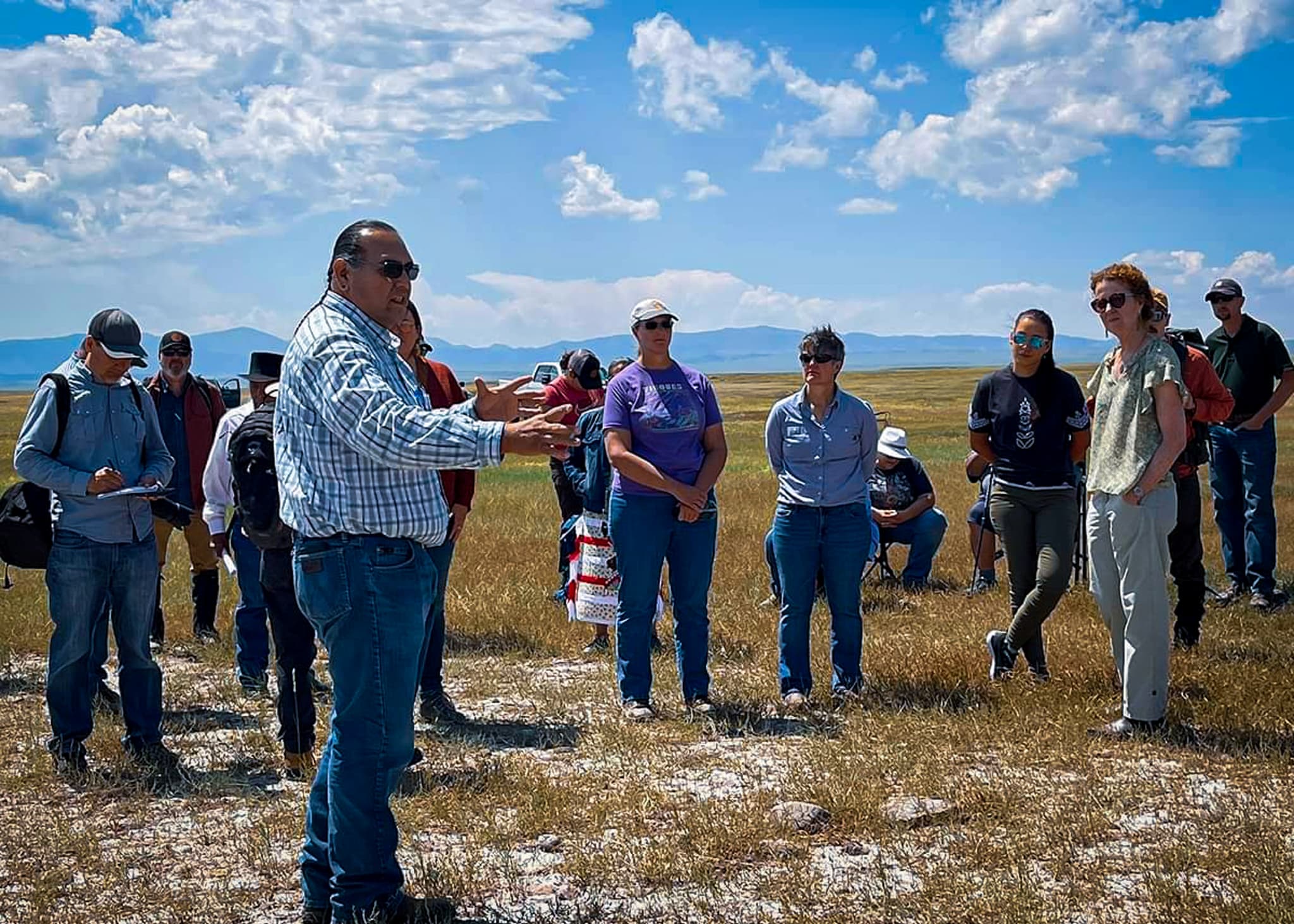 Michael Black Wolf speaking with Montana community members
