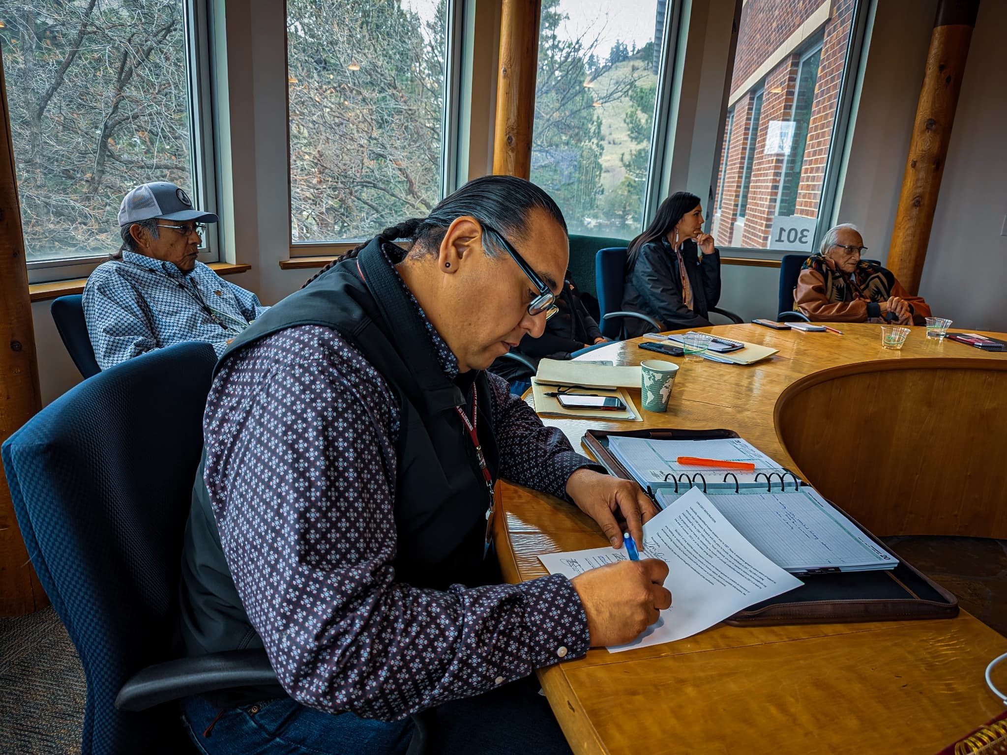 Michael Black Wolf reviewing campaign materials